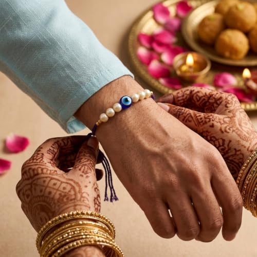 Image of Evil Eye Pearl Rakhi with Krishna Flute Designer Pooja Thali, Red T-Shirt, Greeting Card & Roli Chawal | Nazar Suraksha Rakhi Gift Combo for Brother | Raksha Bandhan Gift Set