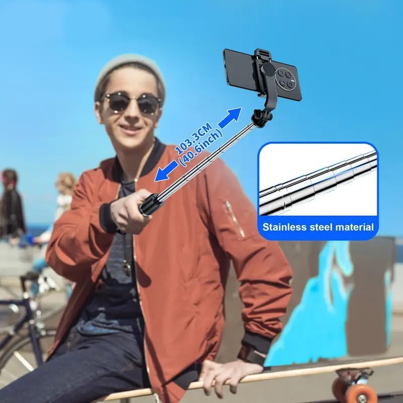 User holding the TINKSEN S02 selfie stick fully extended to 40.6 inches, highlighting its stainless steel material.