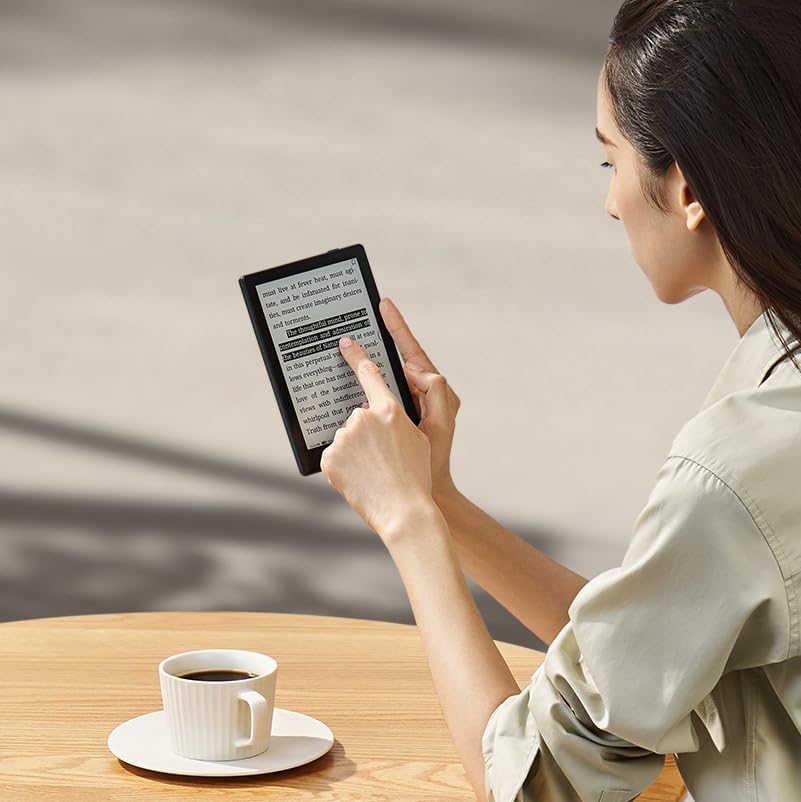 Woman interacting with Onyx E Ink Tablet Go Series 6 Inch eReader