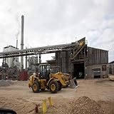 Front End Loader Ready to Load Wood Chips Alabama River Pulp Company and the Claiborne Mill Complex Claiborne Alabama Since 1978 the Alabama River Pulp Company and the Claiborne Mill Complex have been