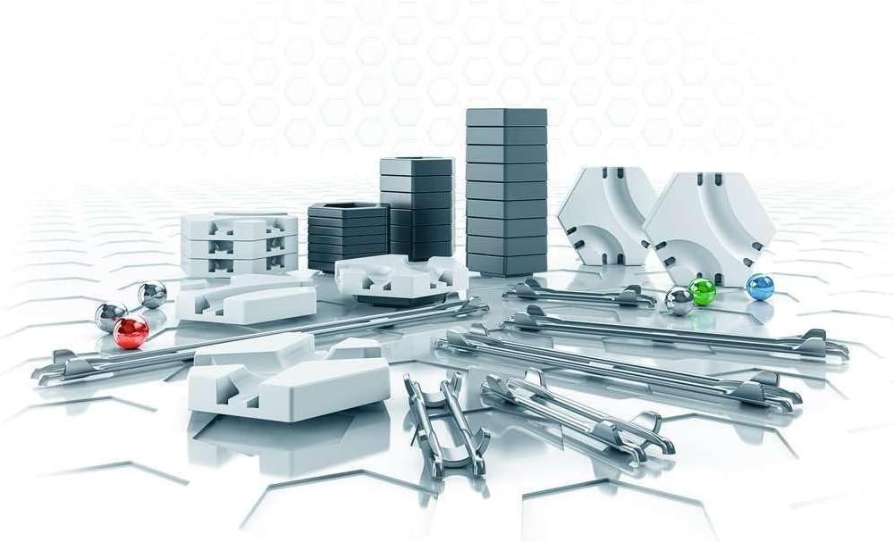 Close-up of GraviTrax track pieces and marbles, showing how they connect and guide the marbles.