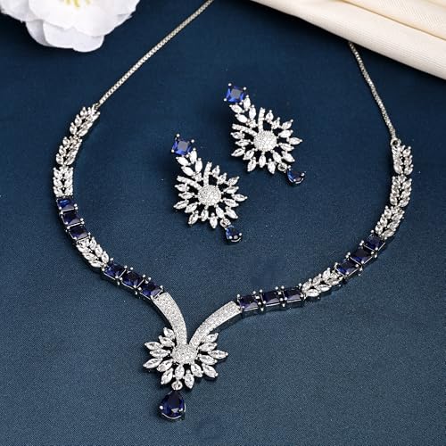 Image of ZENEME Rhodium Plated Brass Silver Toned Floral & Tear Drop Blue Crystal American Diamond Necklace With Earring Jewellery Set For Women