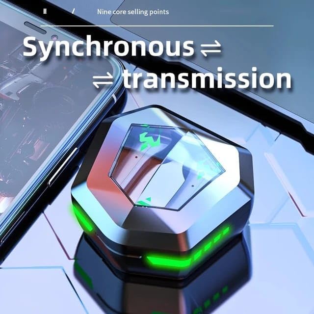 Closed N35 charging case on a laptop keyboard next to a smartphone, symbolizing synchronous transmission.