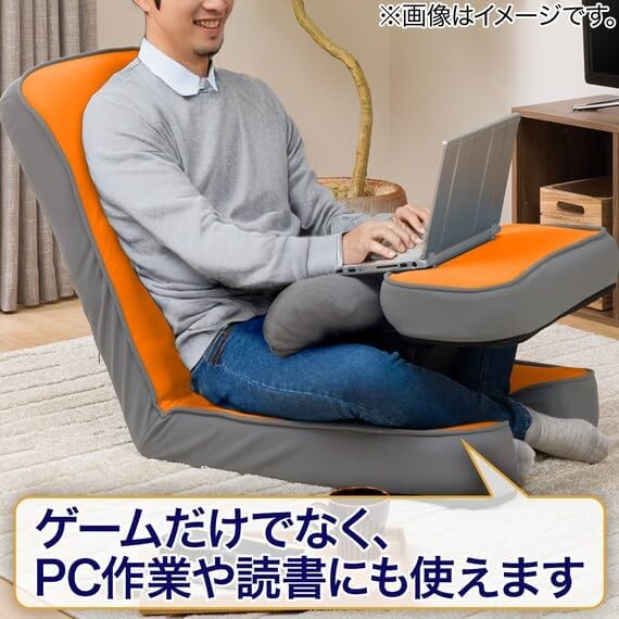 Person using a laptop on the Nitori Gaming Chair's integrated table