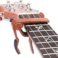 Pro for Ukulele: Small size perfect for the necks and fingerboards of all types Ukulele. Quick Release: Quickly and easily released and re-positioned without disturbing the tuning. Strong Spring: Spring action clamp holds capo firmly in place, keeps ...