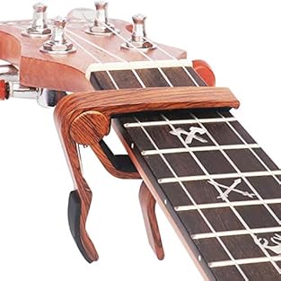 Pro for Ukulele: Small size perfect for the necks and fingerboards of all types Ukulele. Quick Release: Quickly and easily released and re-positioned without disturbing the tuning. Strong Spring: Spring action clamp holds capo firmly in place, keeps ...