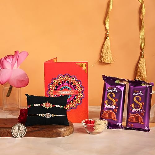 Image of Frostick Designer Rakhi With Chocolate Gift for Bhaiya /Bhai /Brother With Greeting Card, Tilak Chawal And Silver coin (Diary Milk Silk 2pcs, Pack of 2) (Random Design Rakhi)