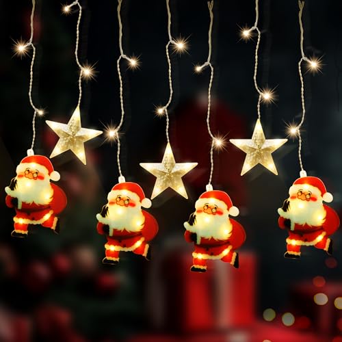 Décoration de Noël avec Père Noël automate au pied du sapin familial