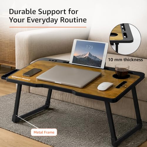 Image of Amazon Basics Engineered Wood Foldable Laptop Table with Cup and Pen Holder, Tablet and Mobile Phone Groove | Mini Drawer, Use for Writing, Bed, Breakfast (60L x 40W x 25H cm, Brown)