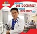 Que Hacen Los Doctores? / What Do Doctors Do? (Ayudantes de La Comunidad / Helping the Community) (Spanish and English Edition)