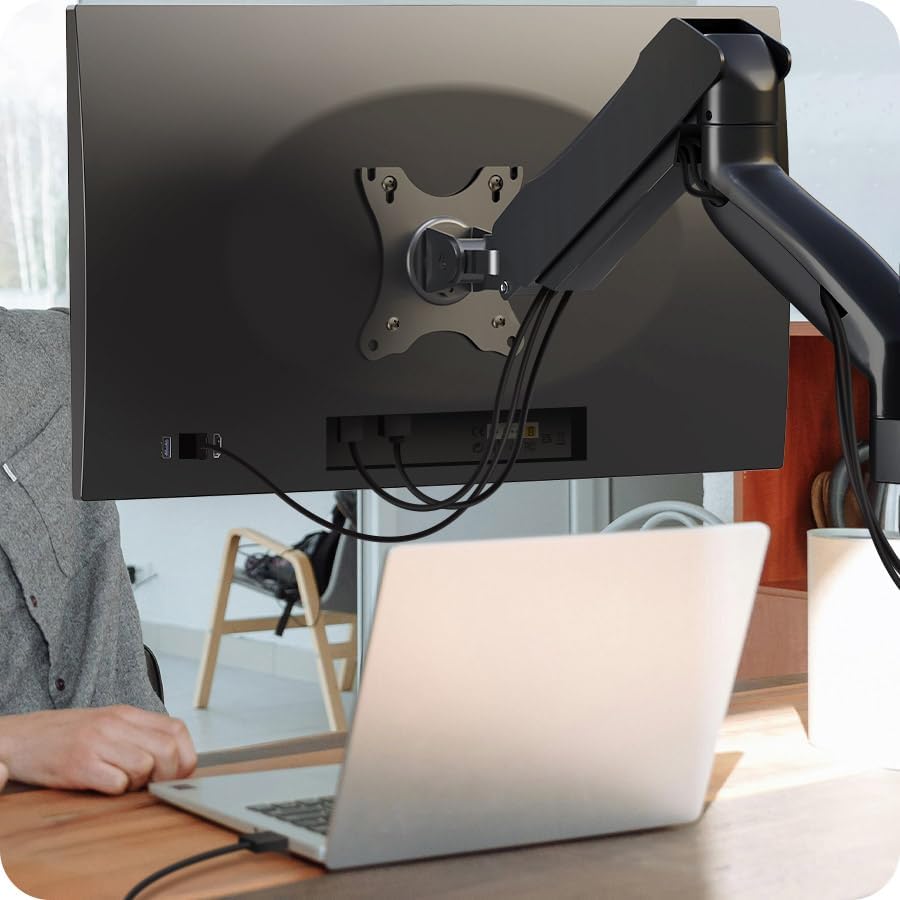 Cable management system on the monitor arm