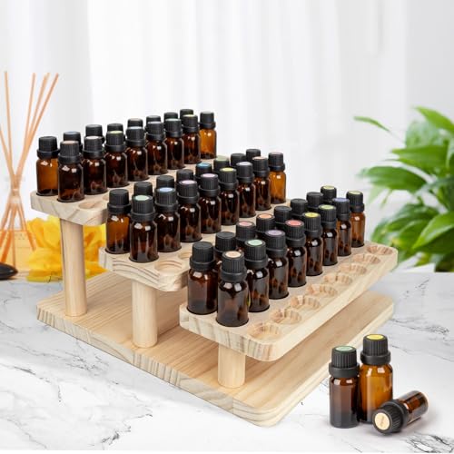 Esmalte de uñas y aceites aromáticos ordenados en una caja de madera con compartimentos 3