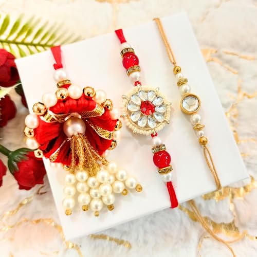 Image of NUTRISNACKSBOX Rakhi Gift Hamper Red for Brother & Bhabhi | 14 Items Premium Gift Box | Dry Fruits, Cookies, Chocolates, 2 Rakhis & Lumba