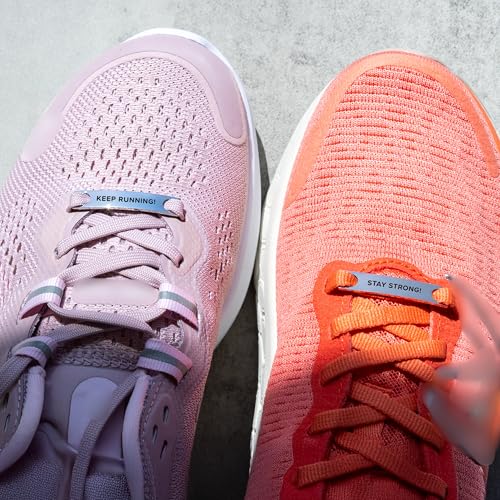 Motivational shoe tags reading Stay Strong and Keep Running attached to pink and orange running shoes
