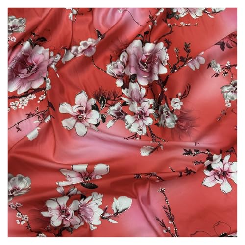 Tissu satiné soyeux motif floral rouge pour coudre une robe de créatrice