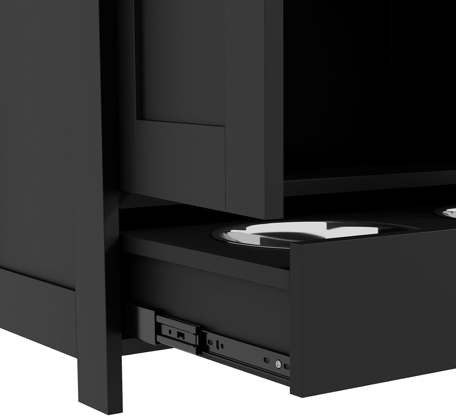 Close-up of the drawer with stainless steel bowls pulled out, showing the drawer slides.