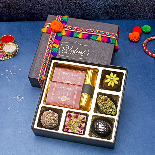 Image of Velvet Fine Chocolates Rakhi Gift Hampers Pack for Brother & Sister | Rakhi Gift Box with 5 Assorted Chocolates, 1 Cranberry Log, 1 Hazelnut Chocolate Bar, 1 Orange Chocolate Bar & Rakhi
