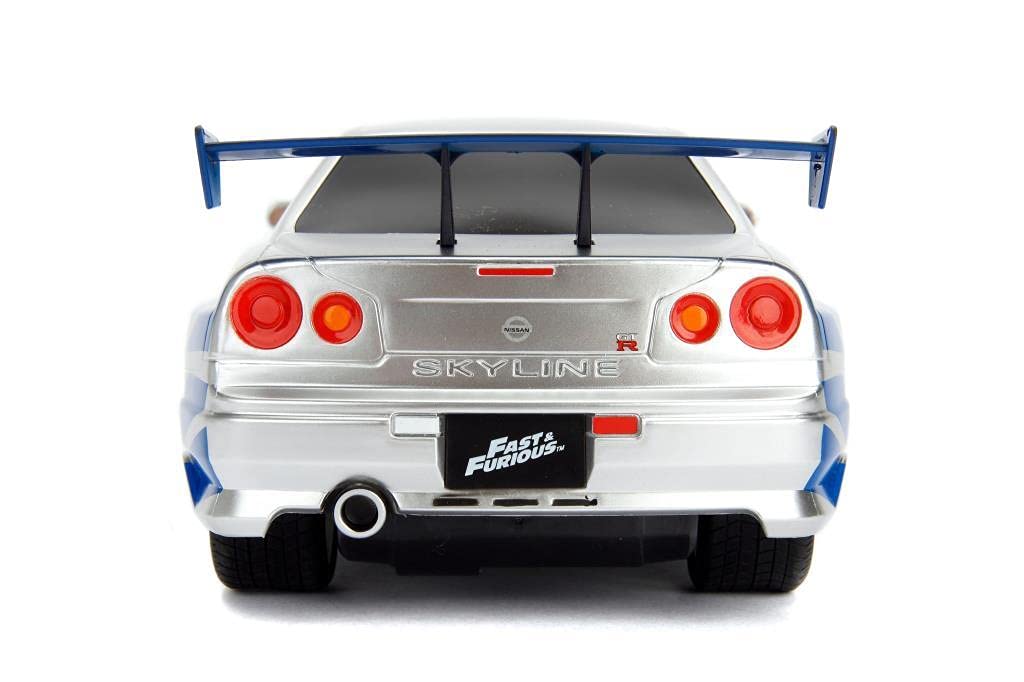 Jada Toys Fast & Furious RC samochód wyścigowy, Nissan Skyline GT-R, R34, samochód zdalnie sterowany, funkcja turbo, dwukanałowy, pilot radiowy, funkcja ładowania USB, baterie w zestawie, 1:16, 29 cm