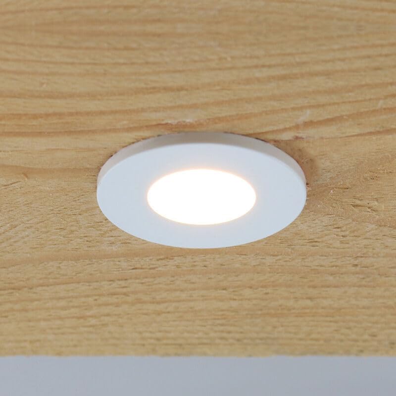 Single Olucia Dico spotlight installed in a wooden panel