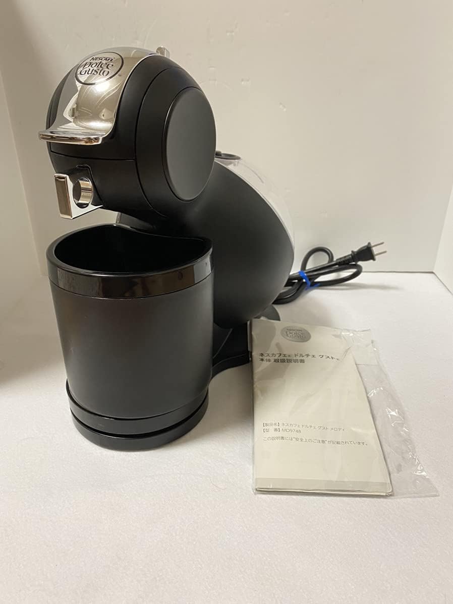 Ġenb view of NESCAFE DOLCE GUSTO MD9748-MB showing the transparent water tank