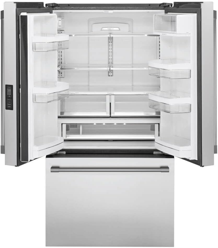 Interior view of the empty Monogram ZWE23NSTSS refrigerator, showing shelves and drawers.