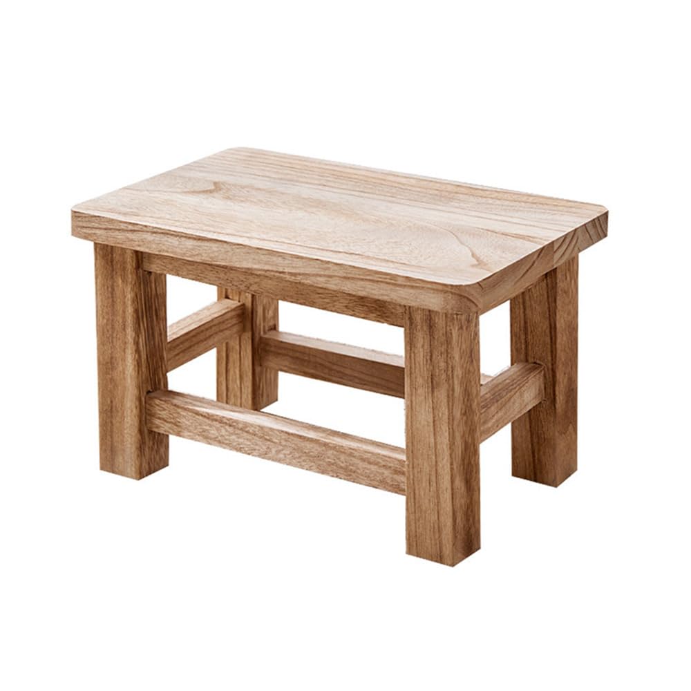 Tabouret bas en bois massif de forme hexagonale aux finitions artisanales