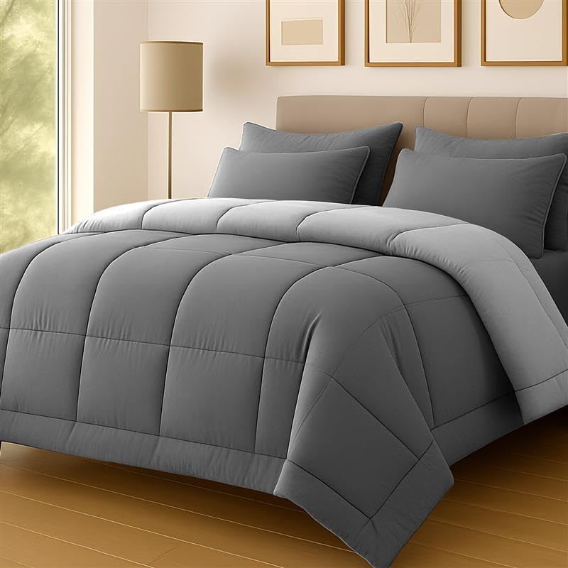Grey two-tone Lazzaro 10.5 tog duvet folded on a bed