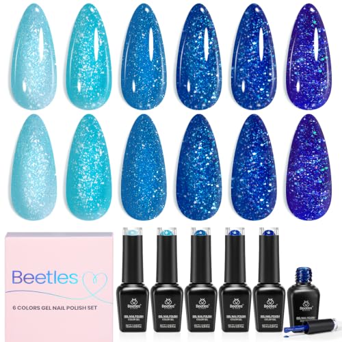 Image of Six blue glitter gel shades create deep shimmer nail looks; cure with UV /LED lamp.