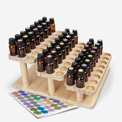 Esmalte de uñas y aceites aromáticos ordenados en una caja de madera con compartimentos 2