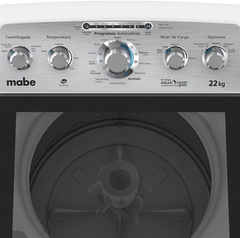 Close-up view of the Mabe washing machine's control panel, showing various knobs and buttons for cycle selection, temperature, load level, and options.