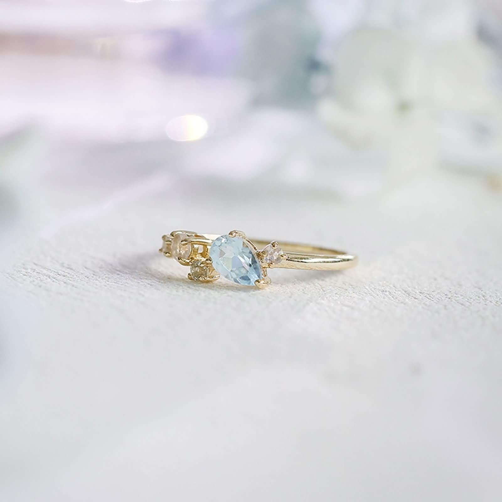 Anillo de compromiso de oro 9 K/14 K/18 K con gotas de topacio azul claro, forma de lágrima
