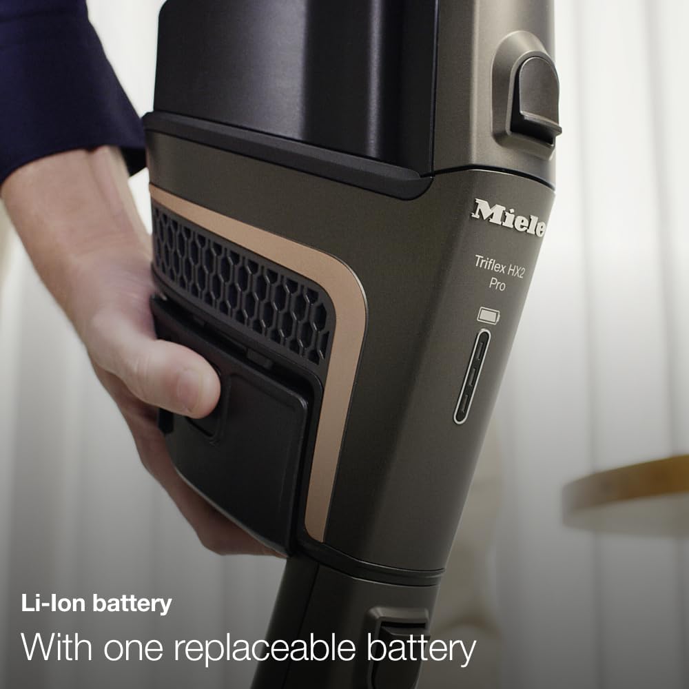 Close-up of the Miele Triflex HX2 Pro battery compartment, showing a removable Li-ion battery.