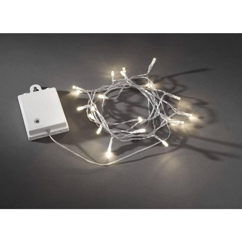 Konstsmide LED Lichterkette, mit an/aus Schalter, Lichtsensor, 6h und 9h Timer, 80 warm weiße Dioden, batteriebetrieben, Außen (IP44), transparentes Kabel, weiße Box, 2 x D 1.5V (exkl.) - 3728-103