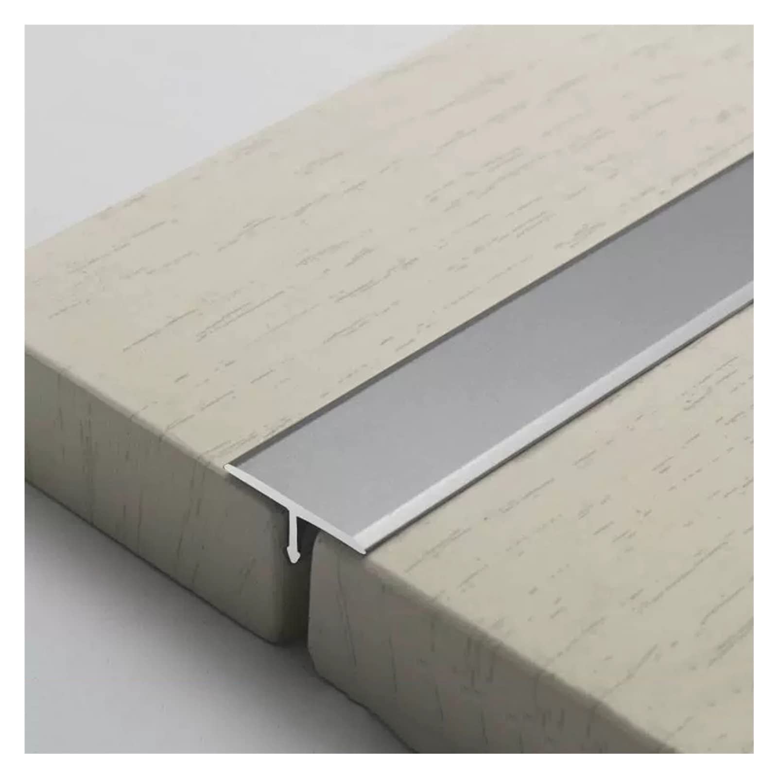 Perfil de suelo T-S de 2 cm en aluminio plata para transición de alfombra y puerta de cocina