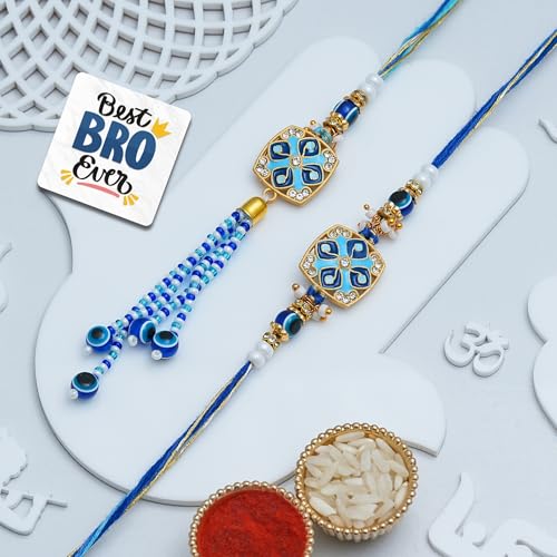 Image of eCraftIndia Blue Beautiful Floral Evil Eye Designer Bhaiya Bhabhi Rakhis with Best Bro Ever Fridge Magnet | Set of 2 Rakhi for Brother and Bhabhi | Lumba Rakhi | Roli Chawal Pack