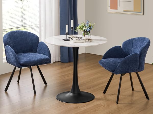 Two Yaheetech swivel dining chairs placed around a small dining table in a home setting.