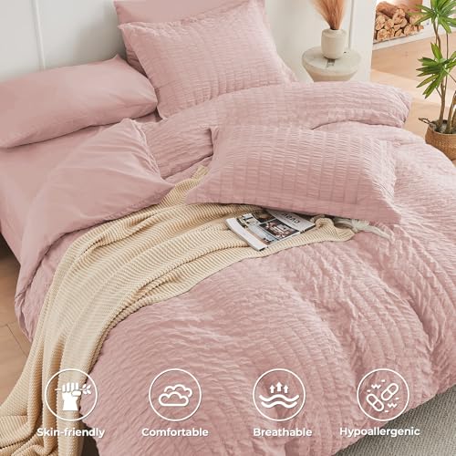 Image of HYMOKEGE Rose Gold Oversized King Comforter Set Seersucker 7 Pieces, All Season Luxury Bed in a Bag for Bedroom, Bedding Set with Comforter, Sheets, Pillowcases & Shams