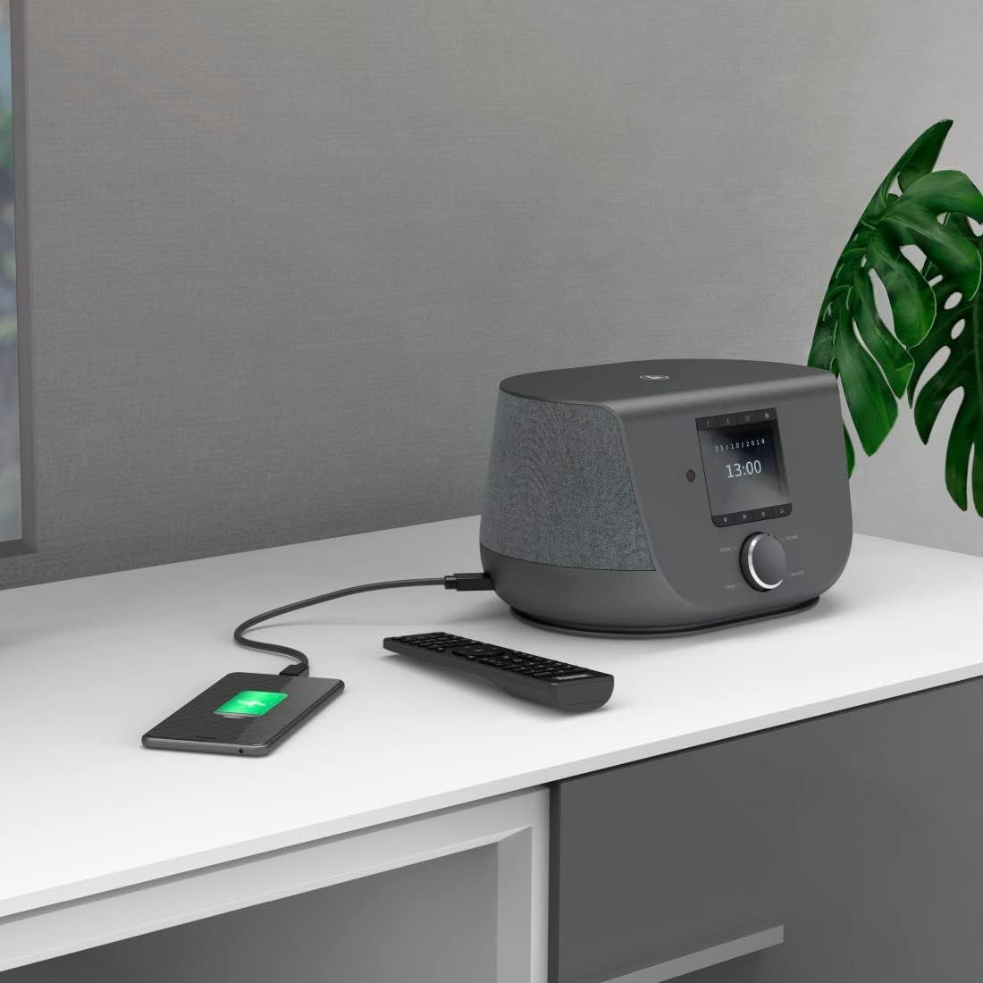 Hama Digital Internet Radio charging a smartphone via its USB port.