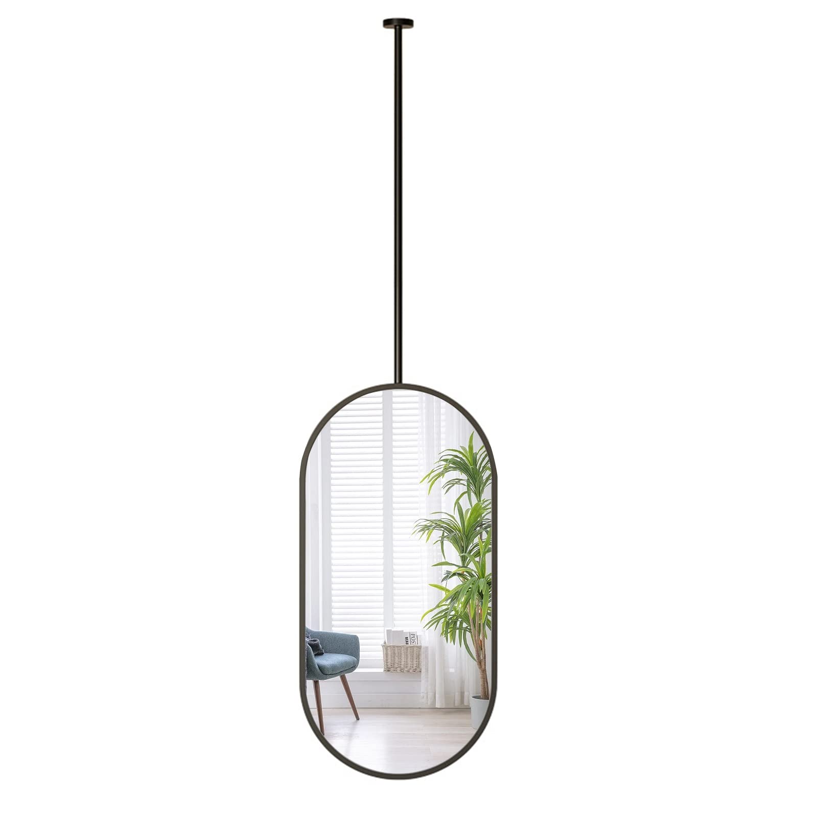 Miroir suspendu ovale noir dans la salle de bain pour une routine moderne