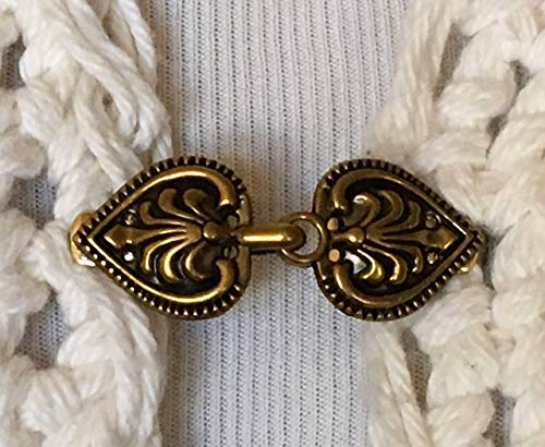 The mattie antiqued Gold Tone Metal Celtic Heart Sweater Clip Clasp.