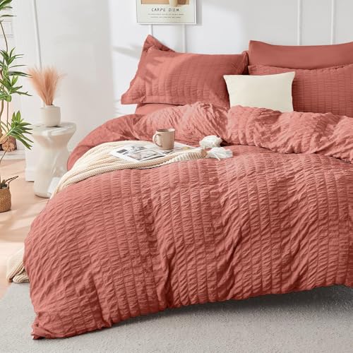 Image of HYMOKEGE Coral King Size Comforter Set Seersucker 7 Pieces, All Season Luxury Bed in a Bag for Bedroom, Bedding Set with Comforter, Sheets, Pillowcases & Shams