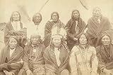 Group portrait of Lakota chiefs five standing and five sitting with tipi in background--probably on or near Pine Ridge Indian Reservation The chiefs who counseled with Gen Miles and settled [sic] the