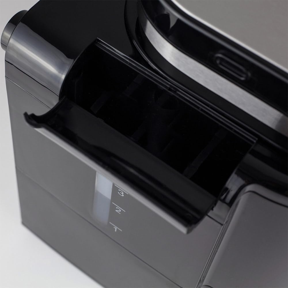 വശം view of coffee machine showing water tank