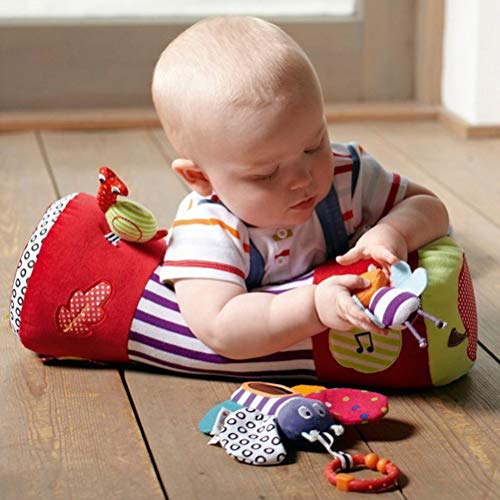 Aider bébé à ramper avec le rouleau de motricité en peluche coloré