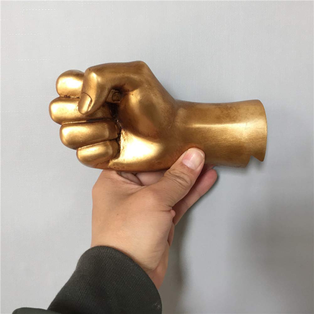 Décoration d'intérieur unique et cadeau original : la main murale dorée pour clés et bijoux
