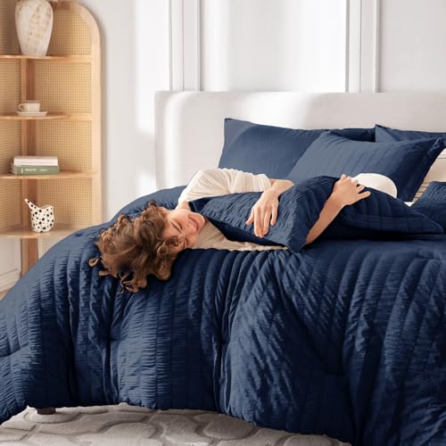 Image of MUXHOMO 7 Pieces Oversized Queen Comforter Set, Seersucker Bed in a Bag Oversized Queen Size, All Season Luxury Bedding Set with Comforter, Flat Sheet, Fitted Sheet, Pillowcases & Shams, Navy Blue