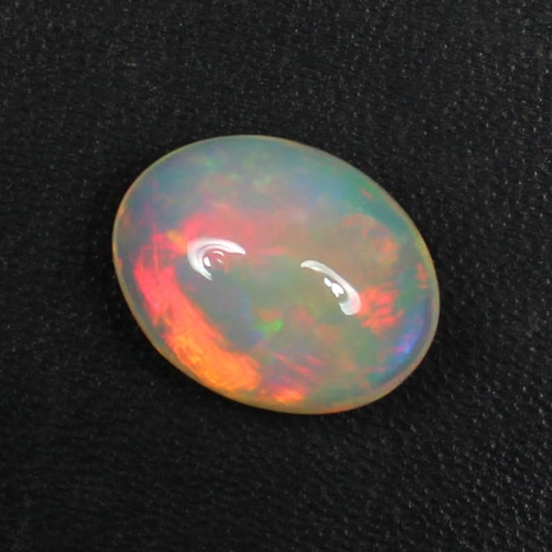 Opale éthiopienne Welo naturelle : cabochon ovale 15,5 mm multi fire AAA