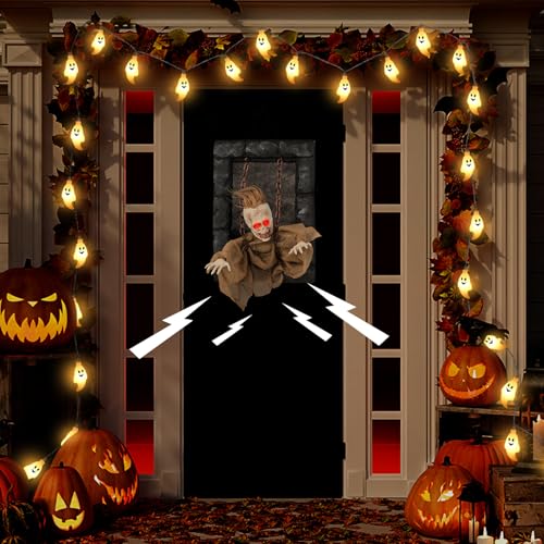 Animated zombie decoration hanging on a door