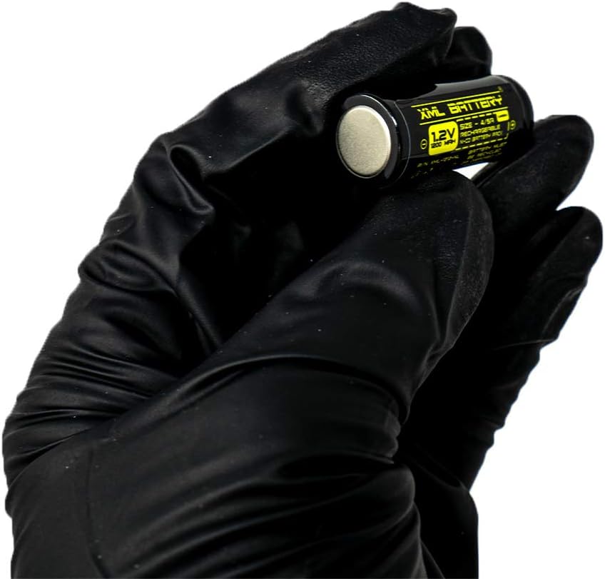 Hand in black glove holding a single XML Battery