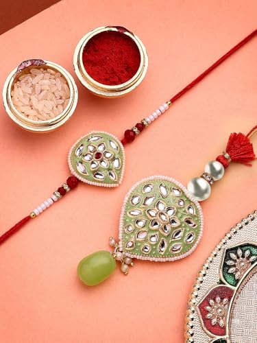 Image of Sukkhi Rakhi Creative Gold Plated with Meenakari Handwork Om Rakshabandhan Lumba Rakhi for Brother Bhaiya Bhabhi with Roli Chawal & Greeting Card|Set of 2